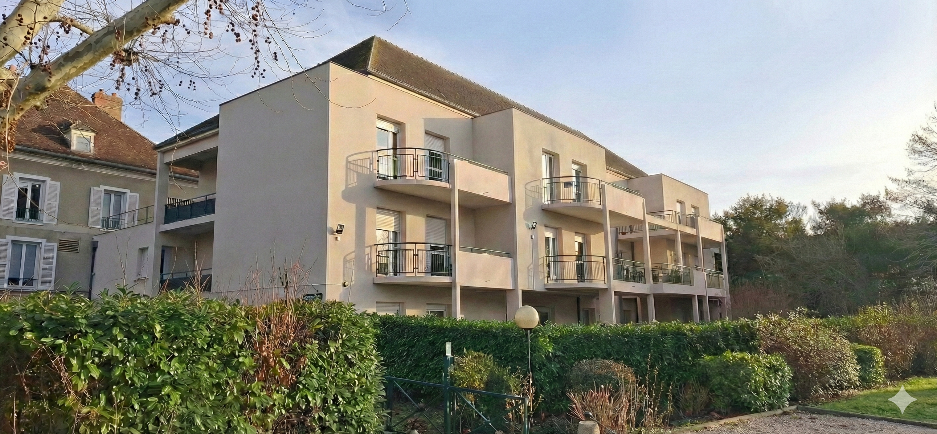 Perspective du bâtiment D entouré de jardins paysagers